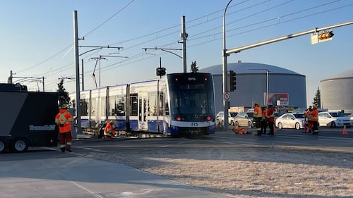 Crews and police respond to a morning crash between an LRT train and a semi-truck on Nov. 26, 2025. (Evan Klippenstein/CTV News Edmonton)