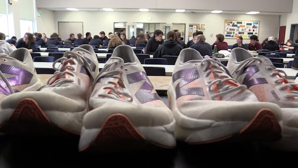 ‘Everything adds up’: Recent high school grads give away 120 pairs of running shoes