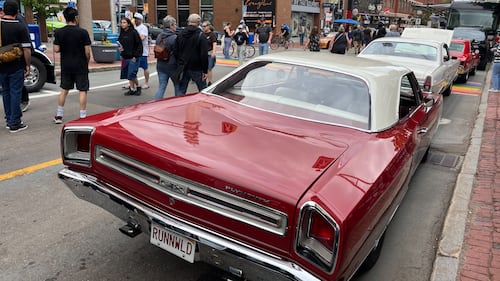A classic red car is pictured.