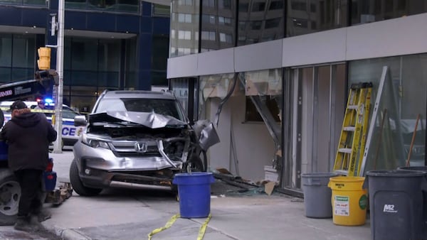 Vehicle strikes pedestrian, building in Centretown