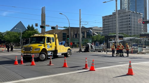 A driver was hospitalized after rolling their vehicle at 100 Street and 102 Avenue, disrupting LRT service for several hours, in Edmonton on June 24, 2026. (Evan Klippenstein / CTV News Edmonton)