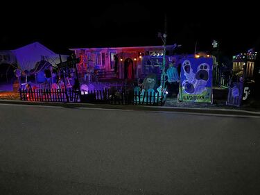The Halloween display outside of Kevin Whittaker's haunted house is seen at night. (Courtesy: Riley Malcolm)