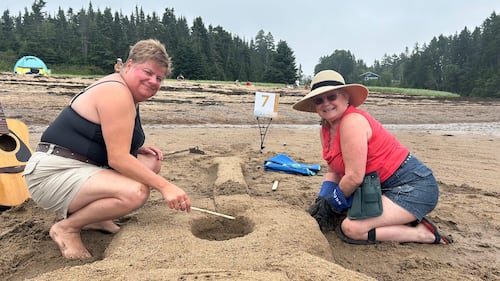 First year sand sculptors Cathy McCabe and April Berry create a guitar out of sand out of a love for music. (CTV/Avery MacRae)