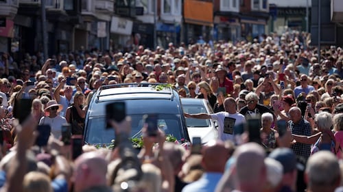 Bonnie Tyler fans line the streets of a Welsh village as her coffin is brought home