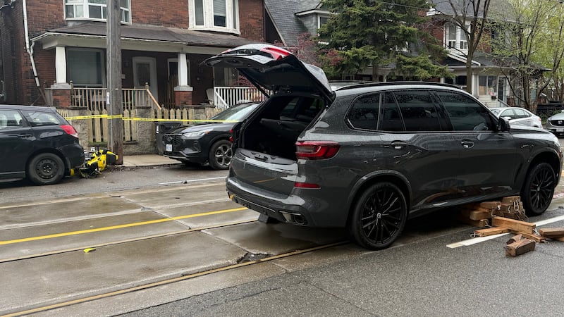 Motorcyclist trapped underneath SUV after collision dies, police say