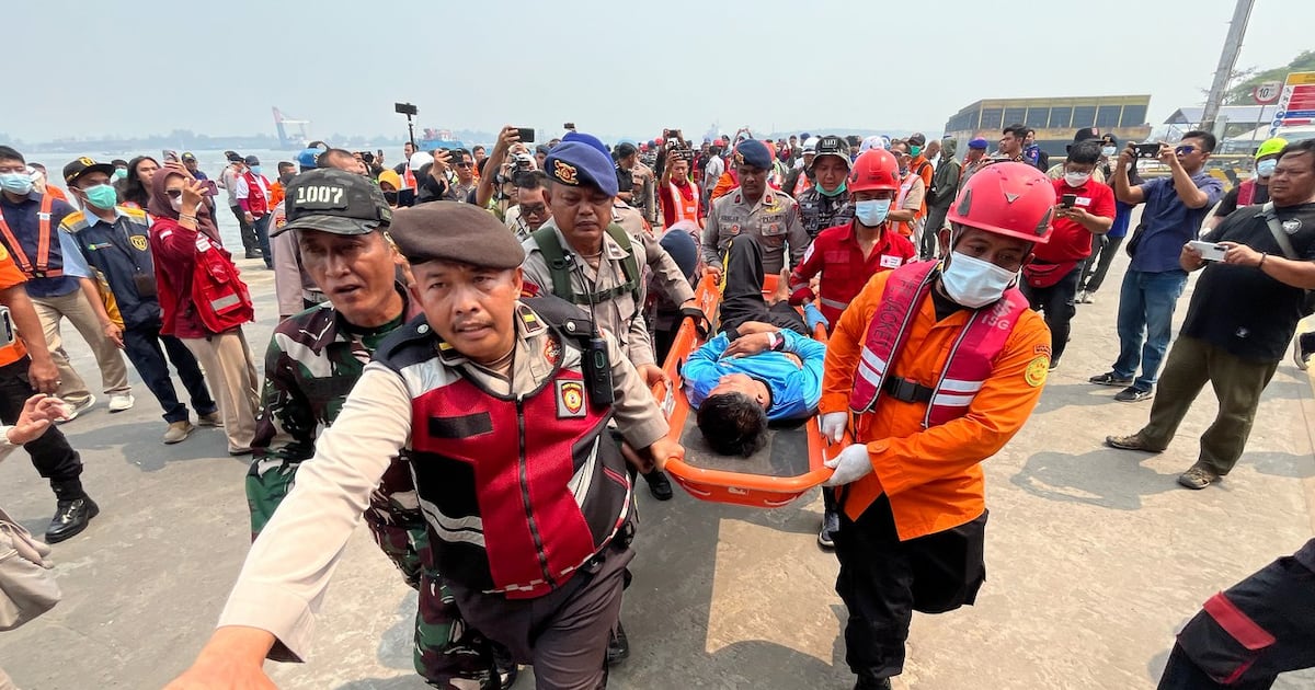 Photo: ctvnews.ca In this photo taken with a smartphone, rescuers carry a survivor from a passenger ferry overturned in bad weather in the