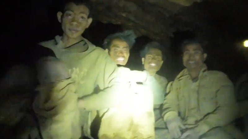 Rescuers free 4 men who had been trapped in a flooded Laos cave, search for 2 still missing