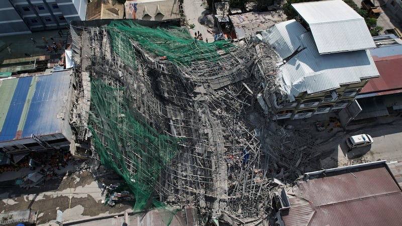 Building under construction in Philippines collapses, leaving 1 dead and 21 trapped