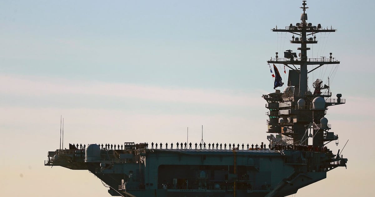 Photo: ctvnews.ca Sailors and marines line the deck of aircraft carrier USS Abraham Lincoln (CVN-72) as it deploys from San Diego,, Jan. 3