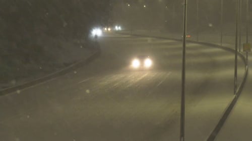 Motorists drive on snowy roads in Edmonton the early morning of Feb. 17, 2026. (Evan Klippenstein / CTV News Edmonton)