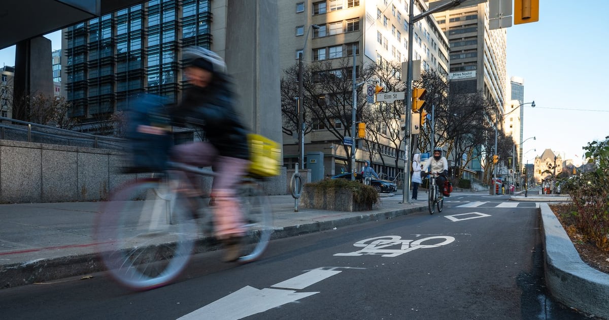 Photo: ctvnews.ca A cyclist rides in a bike lane on University Avenue in Toronto on Friday, December 13, 2024. THE CANADIAN PRESS/Laura Proctor