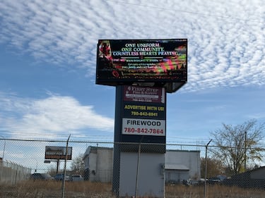 An electronic message board at the west entrance to Wainwright, Alta., reads, "One uniform, one community, countless hearts praying," on Oct. 19, 2026, two days after the deady incident at CFB Wainwright. (Nicole Weisberg / CTV News Edmonton)
