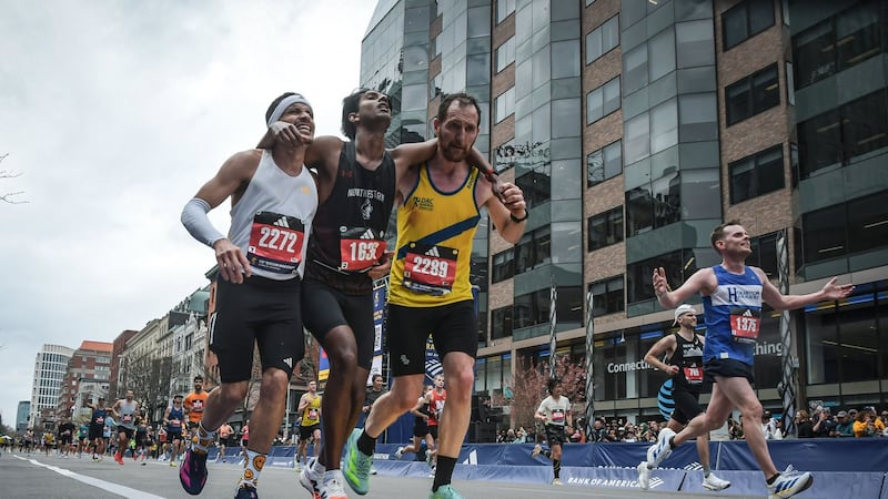 Man who helped fellow runner across Boston Marathon finish line says it was natural instinct to help