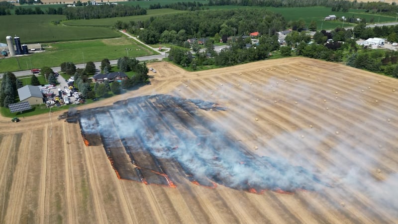 Massive grass fire ignites hay bales burning acres of farmland