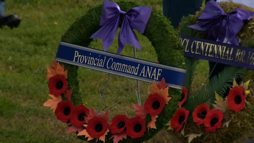 A wreath with poppies is pictured.