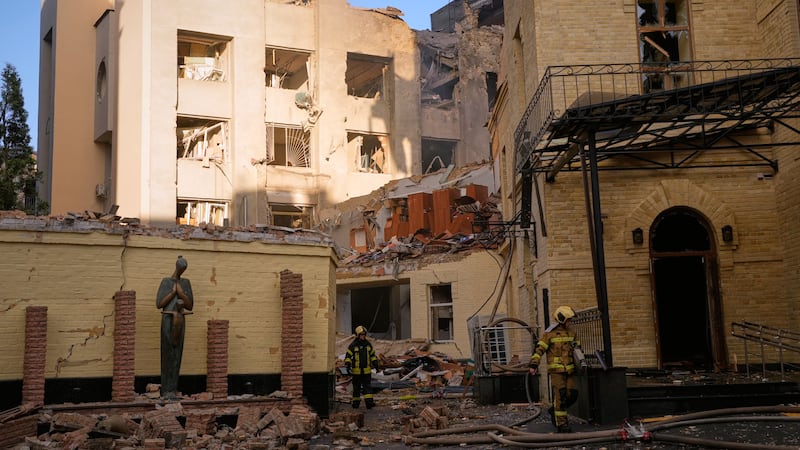Kyiv hit by large wave of Russian strikes, people feared trapped in apartment building rubble