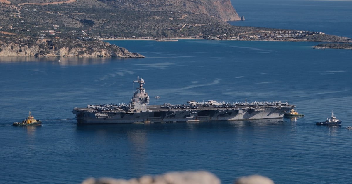 The USS Gerald R. Ford departs from Souda Naval Base near Chania on the island of Crete, Greece, Feb. 26, 2026. (AP Photo/Giannis Angelakis)