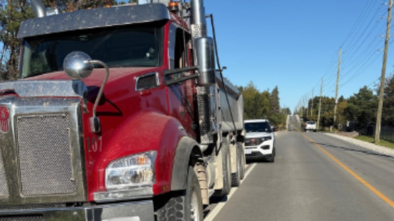 Raised trailer box strikes power lines