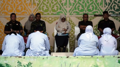 Couple caned for kissing on TikTok in Indonesia's conservative Aceh province