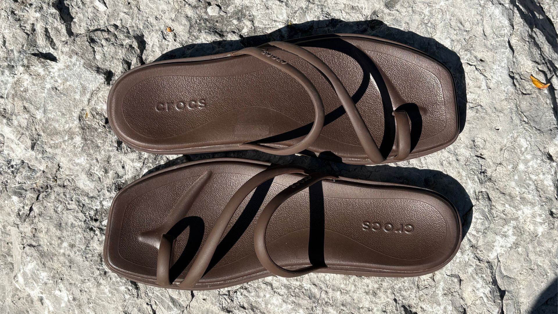 the sandals on a rock outside