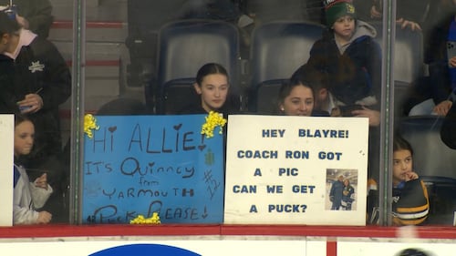 Fans hold up signs at a PWHL Takeover Tour game in Halifax between Montreal Victory and the Toronto Sceptres on Dec. 17, 2025. (CTV Atlantic / Jim Kvammen)