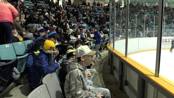 Thousands of elementary students cheer on Golden Hawks women’s hockey team during annual event