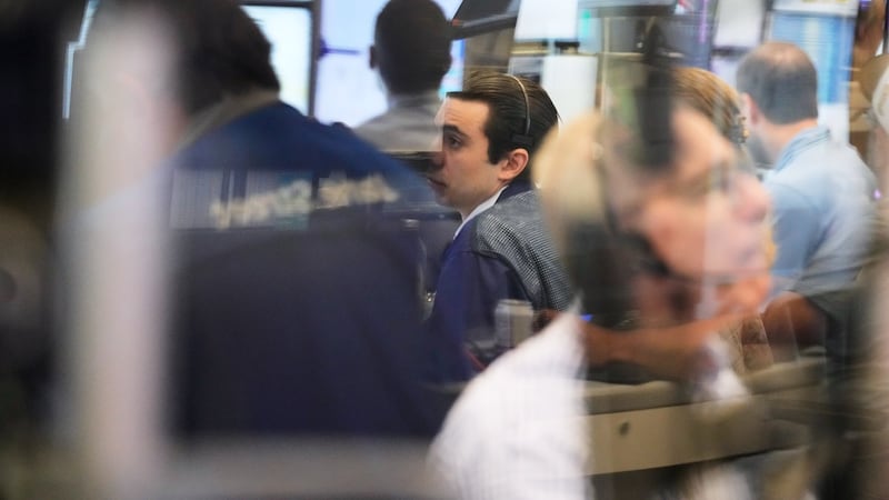 Global shares are trading mixed as market optimism about AI gets tempered by Iran worries