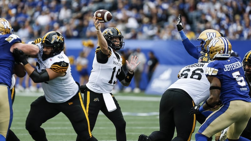 Mitchell tosses three TDs in Ticats' 37-27 win over Blue Bombers