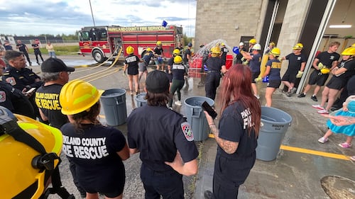 Parkland County firefighters compete in the inaugural Battle for the Bell skills competition in Acheson, Alta., on Aug. 11, 2026. (Dave Mitchell / CTV News Edmonton)