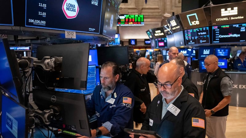 U.S. stocks rise to a record as oil prices drop and inflation gets less bad