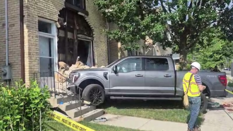 Two-vehicle collision sends pickup truck careening into south London home