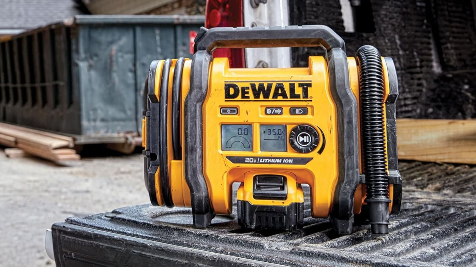 A DEWALT 20V MAX* Cordless Tire Inflator on the back of a truck.