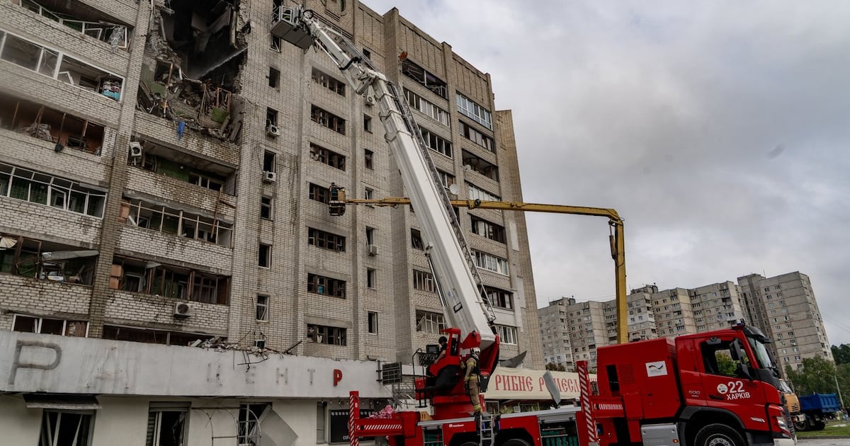 Firefighters put out a fire after a residential building was hit following Russia's drone attack in Kharkiv, Ukraine, Sunday, Aug. 9, 2026. (AP Photo/Andrii Marienko)