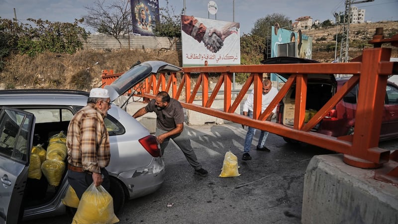 Israel imposes closures across a West Bank city after attacks, and other Mideast news