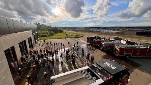 Parkland County firefighters compete in the inaugural Battle for the Bell skills competition in Acheson, Alta., on Aug. 11, 2026. (Dave Mitchell / CTV News Edmonton)