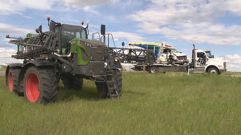 Crash between tractor sprayer and ambulance near Airdrie leaves 3 injured
