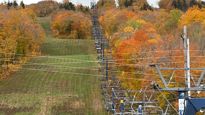 Visitors take in the autumn colours at New Brunswick’s Crabbe Mountain