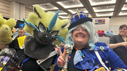 A pair of cosplayers smile for a photo at Animaritime. (Avery MacRae/CTV News)