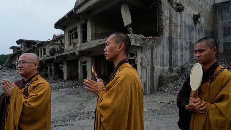 Nepal holds a day of mourning after floods kill at least 1,300 people