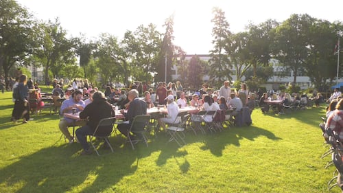 People sit at tables during the KDays pancake breakfast at the Alberta legislature on July 16, 2026. (Sean McClune / CTV News Edmonton)