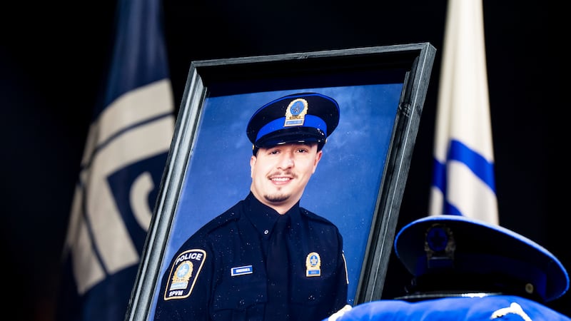 Police officers march in Montreal ahead of funeral for officer killed in shooting