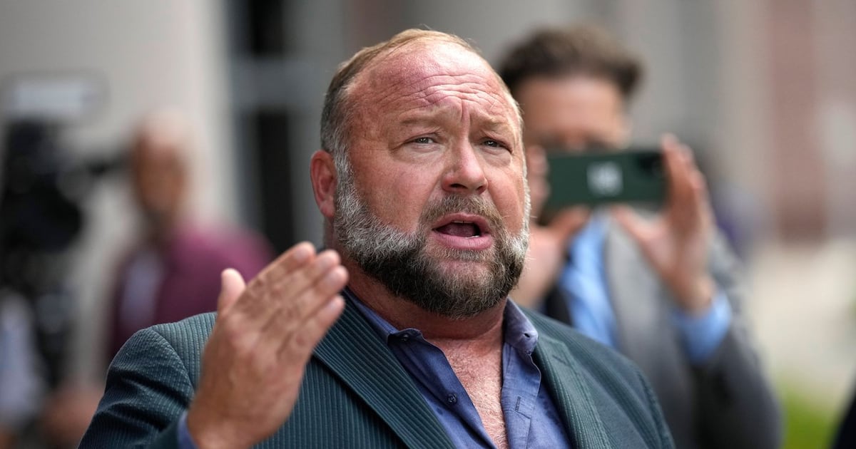Right-wing conspiracy theorist Alex Jones speaks to the media after arriving at the federal courthouse for a hearing in front of a bankruptcy judge in Houston, June 14, 2024. (AP Photo/David J. Phillip, File)