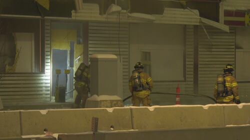 Firefighters work at the old Jasper Place Hotel along Stony Plain Road in Edmonton the early morning of Feb. 19, 2026. (Sean McClune / CTV News Edmonton)