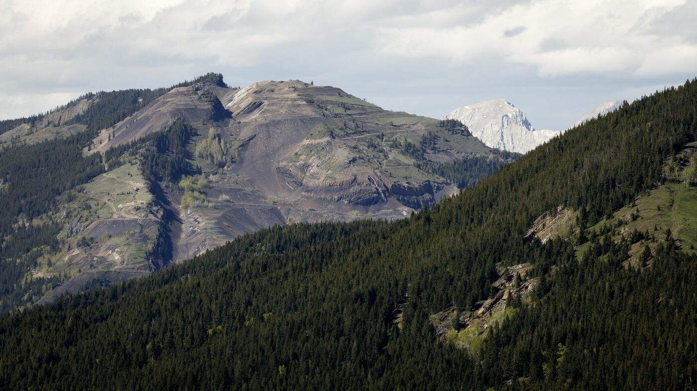 Grassy Mountain, peak to left, and the Grassy Mountain Coal Project are seen north of Blairmore, Alta., Thursday, June 6, 2024. (THE CANADIAN PRESS/Jeff McIntosh)