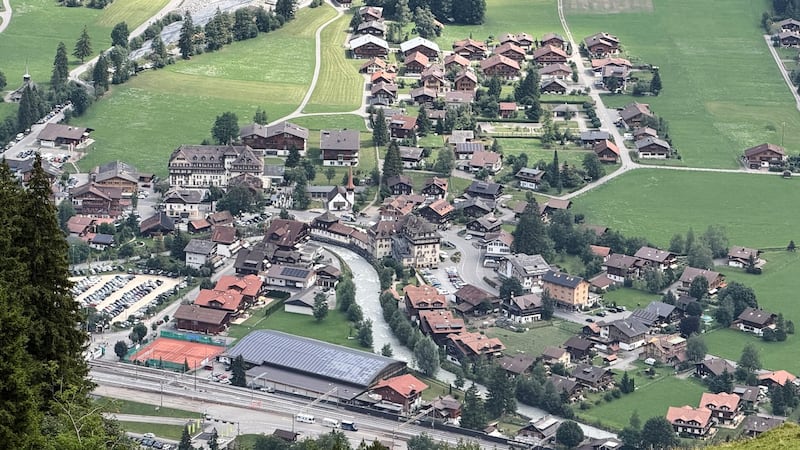 A looming rock collapse threatens a Swiss village as thawing permafrost destabilizes the Alps