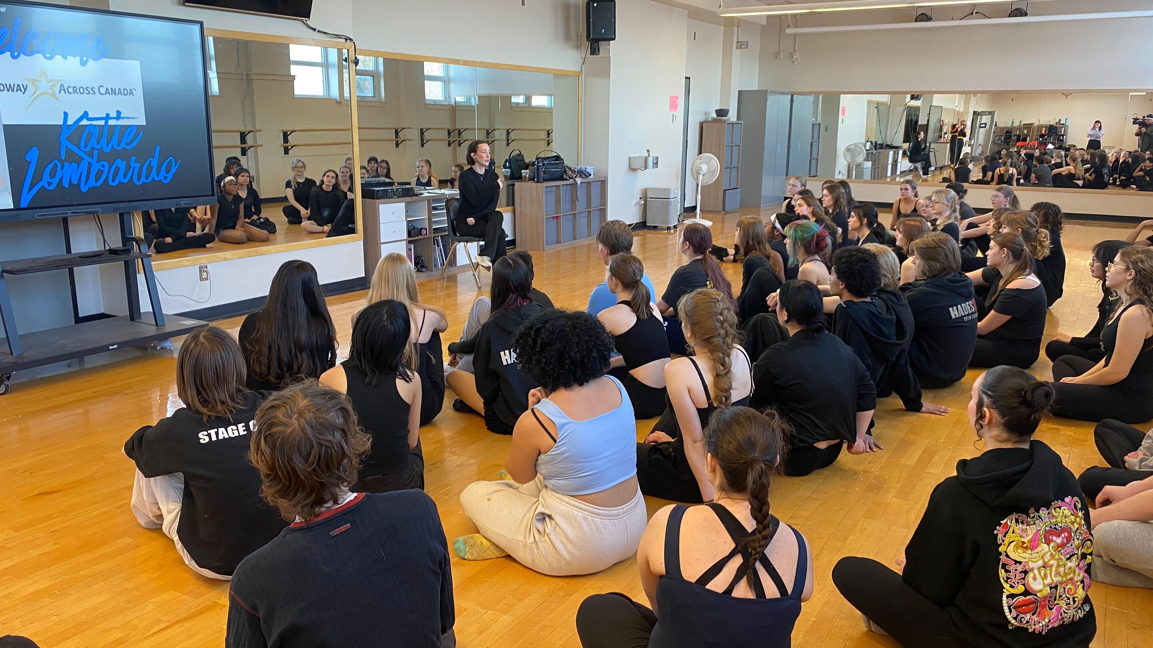 Katie Lombardo, a dance captain with Moulin Rouge! The Musical presented by Broadway Across Canada, speaks to theatre students at Strathcona High School in Edmonton on Jan. 15, 2026. (Dave Mitchell/CTV News Edmonton)