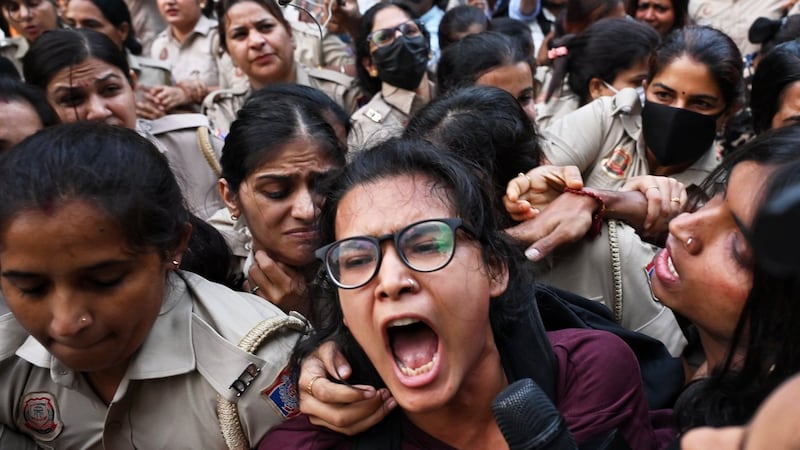 Crowds throng New Delhi and wave Indian flags amid escalating protests