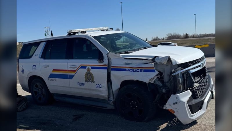 Woman charged after stolen truck strikes officer, crashes into school bus