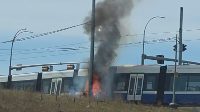 Fiery crash between vehicle, LRT closes several roads near Whitemud Drive