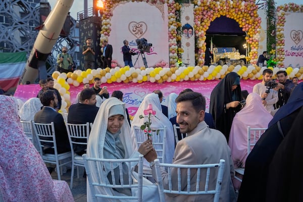 Iran stages mass weddings for couples ready for war ‘sacrifice’
